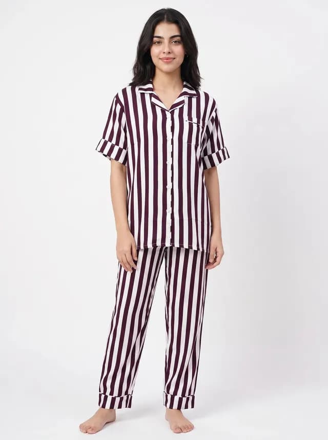 Woman wearing a maroon striped linen PJ set